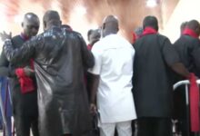 Minority MPs clad in red and black to protest suspension of MPs
