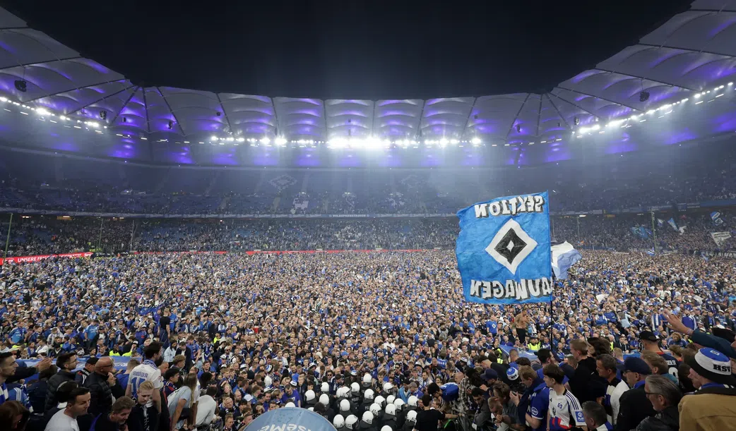 Wild stadium invasion and police clash leaves 25 fans seriously injured