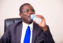 Former managing director (MD) of GWL, Mr Clifford Braimah drinking a bottle of G-Water