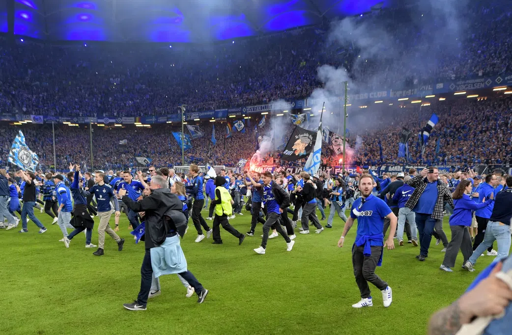 Wild stadium invasion and police clash leaves 25 fans seriously injured
